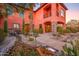 A beautiful stone walkway leads to a tranquil stream and the home's grand entrance at 7500 E Roy Rogers Rd, Scottsdale, AZ 85266