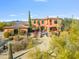 Majestic front exterior with desert landscaping, gated entrance, and mountain views at 7500 E Roy Rogers Rd, Scottsdale, AZ 85266