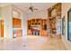 Spacious living room with built-in bar, entertainment center and stone fireplace at 7500 E Roy Rogers Rd, Scottsdale, AZ 85266