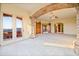 Bright living space boasting a stone archway and access to an outdoor balcony at 7500 E Roy Rogers Rd, Scottsdale, AZ 85266