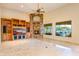 Cozy living room with built-in entertainment center and stone fireplace at 7500 E Roy Rogers Rd, Scottsdale, AZ 85266