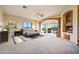 Relaxing bedroom with a stone archway, fireplace, and beautiful outdoor views at 7500 E Roy Rogers Rd, Scottsdale, AZ 85266