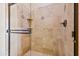 Walk-in shower with glass door and travertine tile at 7500 E Roy Rogers Rd, Scottsdale, AZ 85266