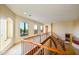 An upstairs hallway featuring marble floors, custom railings, and lots of natural light at 7500 E Roy Rogers Rd, Scottsdale, AZ 85266