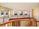 Upstairs hallway with natural light and wrought iron railing at 7500 E Roy Rogers Rd, Scottsdale, AZ 85266