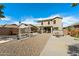 Large backyard showcasing a built-in spa, patio, and desert landscaping at 77 W Diamond Trl, San Tan Valley, AZ 85143