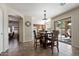 Cozy dining area with access to the kitchen and sliding doors to the backyard at 77 W Diamond Trl, San Tan Valley, AZ 85143