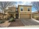 Charming two-story home featuring a two-car garage and low maintenance landscaping at 77 W Diamond Trl, San Tan Valley, AZ 85143