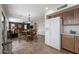 Inviting eat-in kitchen featuring stainless steel appliances and a seamless connection to the cozy living area at 77 W Diamond Trl, San Tan Valley, AZ 85143