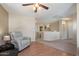 Open loft space with neutral paint, ceiling fan, and view of the downstairs at 77 W Diamond Trl, San Tan Valley, AZ 85143