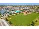 Aerial view of the community featuring a large green space and community pool with surrounding homes at 781 W Flintlock Way, Chandler, AZ 85286