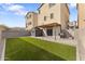 Beautiful backyard featuring artificial grass, a shed, and an open pergola over a patio at 781 W Flintlock Way, Chandler, AZ 85286