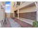 Side yard entrance, with brick accents, provides access to the home's front door at 781 W Flintlock Way, Chandler, AZ 85286