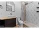 Modern bathroom features geometric shower tile, wood-look floors, and a black faucet at 781 W Flintlock Way, Chandler, AZ 85286