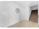 Bonus room with stylish shiplap accent wall, neutral paint, and staircase access at 781 W Flintlock Way, Chandler, AZ 85286