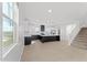 Open-concept kitchen with an island and a view of staircase at 781 W Flintlock Way, Chandler, AZ 85286