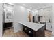 View of kitchen with modern cabinets, marble countertop island, and stainless steel appliances at 781 W Flintlock Way, Chandler, AZ 85286