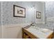 Stylish powder room featuring custom wallpaper and marble countertop at 8336 E Calle De Alegria --, Scottsdale, AZ 85255