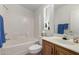 Bright bathroom features tub and shower, and a wood vanity at 8500 E Southern Ave # 488, Mesa, AZ 85209