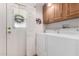 A functional laundry room with cabinets, door to outside, and washer/dryer at 8500 E Southern Ave # 488, Mesa, AZ 85209