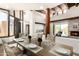 Open-concept dining room featuring a large dining table, an inviting fireplace, and lots of natural light at 8502 E Cave Creek Rd # 53, Carefree, AZ 85377
