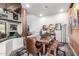 This dining room showcases a rustic table, charming decor, and a peek into the adjacent living room at 8502 E Cave Creek Rd # 53, Carefree, AZ 85377