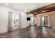 Open living room with hardwood floors, neutral walls, and sliding glass doors to the outdoor space at 8502 E Cave Creek Rd # 53, Carefree, AZ 85377