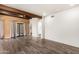 Open living room featuring hardwood floors, neutral walls, and sliding glass doors to the yard at 8502 E Cave Creek Rd # 53, Carefree, AZ 85377