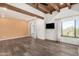 Well-lit living room showcasing hardwood floors, neutral walls, and large windows with natural light at 8502 E Cave Creek Rd # 53, Carefree, AZ 85377