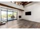 Open living space featuring hardwood floors, lots of light, and an inviting fireplace at 8502 E Cave Creek Rd # 53, Carefree, AZ 85377