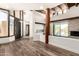 Open-concept living space featuring hard surface floors, lots of natural light, and an inviting fireplace at 8502 E Cave Creek Rd # 53, Carefree, AZ 85377