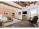 Spacious main bedroom with hardwood floors, ensuite bathroom, and large windows overlooking the yard at 8502 E Cave Creek Rd # 53, Carefree, AZ 85377
