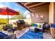 Covered patio with comfortable seating, an outdoor grill, and stylish decor at 8502 E Cave Creek Rd # 53, Carefree, AZ 85377