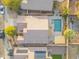 Aerial view of the property, showcasing the pool, patio, and proximity to neighboring homes at 8630 W Apache St, Tolleson, AZ 85353