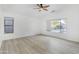 Bright bedroom featuring a vaulted ceiling, ceiling fan, and large windows at 8630 W Apache St, Tolleson, AZ 85353