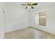 Bright, airy bedroom featuring wood-look floors and a sunny window, creating a peaceful retreat at 8630 W Apache St, Tolleson, AZ 85353