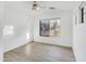 Bedroom with vaulted ceiling, ceiling fan, and a large window at 8630 W Apache St, Tolleson, AZ 85353