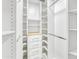 Custom walk-in closet offers an abundance of shelving and drawers for organization at 8630 W Apache St, Tolleson, AZ 85353