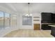 Bright dining area featuring contemporary lighting, floating shelves, and modern design at 8630 W Apache St, Tolleson, AZ 85353