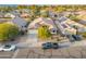 Aerial shot of the house, with a well-kept yard and a view of the surrounding neighborhood at 8630 W Apache St, Tolleson, AZ 85353