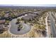 Desert community featuring tile roofed homes and a landscaped cul-de-sac in a planned neighborhood at 8634 E Kael Cir, Mesa, AZ 85207