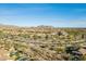 Expansive desert community offering stunning views of the mountains and single Gathering homes with tile roofing at 8634 E Kael Cir, Mesa, AZ 85207