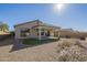 View of the home's landscaped backyard, perfect for relaxing and entertaining at 8634 E Kael Cir, Mesa, AZ 85207