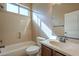 Bathroom featuring tub, shower, and vanity with natural lighting at 8634 E Kael Cir, Mesa, AZ 85207