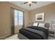 A serene bedroom with neutral tones, blackout curtains and a calming aesthetic at 8634 E Kael Cir, Mesa, AZ 85207