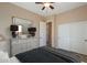 Bright bedroom features a dresser, closet and a connecting door to the bathroom at 8634 E Kael Cir, Mesa, AZ 85207