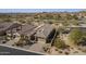 Aerial view of a single-Gathering home showing the tile roof, brick driveway, and low-maintenance desert landscaping at 8634 E Kael Cir, Mesa, AZ 85207