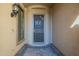 Welcoming front entrance with stylish security door, neutral tones, and brick paver flooring at 8634 E Kael Cir, Mesa, AZ 85207