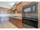 Well-lit kitchen featuring granite countertops and stainless steel appliances at 8634 E Kael Cir, Mesa, AZ 85207