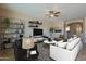 Cozy living room with neutral walls, stylish furniture, and an inviting, relaxing atmosphere at 8634 E Kael Cir, Mesa, AZ 85207